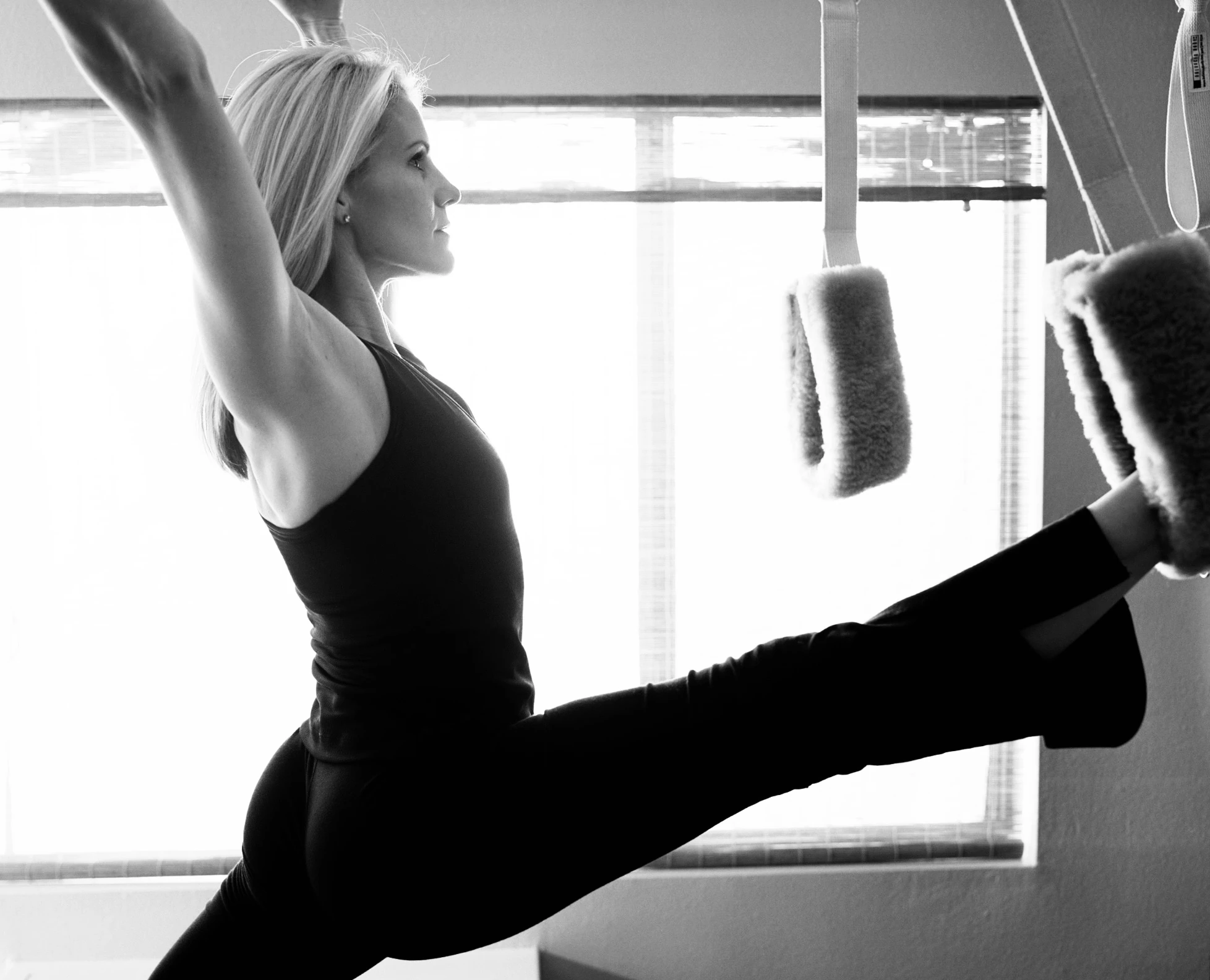 Pilates leg and core strength exercise on a Reformer